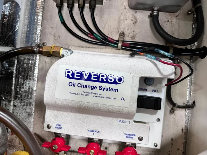 Saylor Moon Yacht Photos Pics Reverso oil change system in 1990 Ocean Yachts 48 Super Sport engine room.