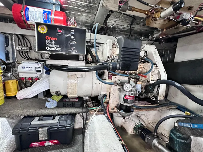 Saylor Moon Yacht Photos Pics Engine room of a 1990 Ocean Yachts 48 Super Sport with Onan generator.