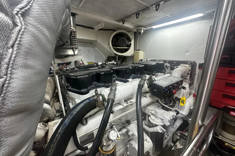 Patrona Yacht Photos Pics Engine room of 2000 Mikelson 61 Sportfisher, showcasing detailed machinery and components.