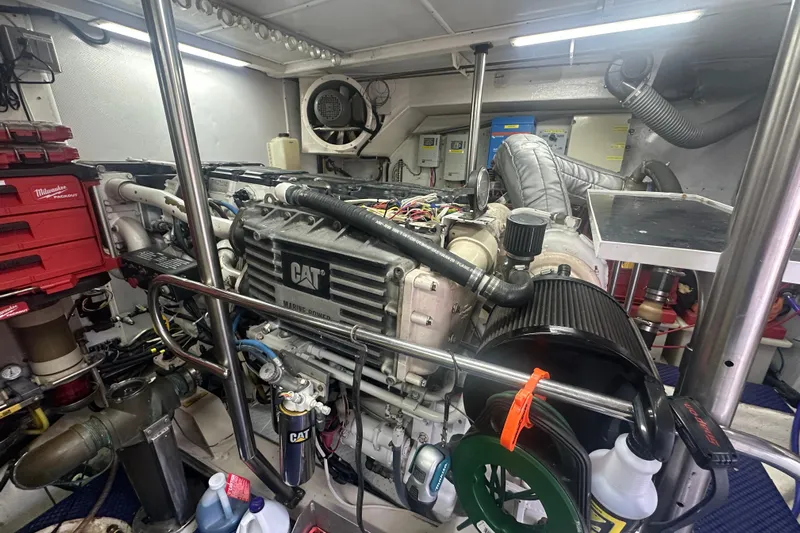 Patrona Yacht Photos Pics Engine room of a 2000 Mikelson 61 Sportfisher with CAT marine engine and tools.