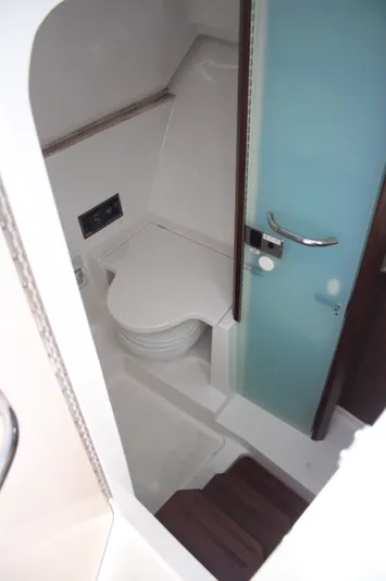 Flawless Seas Yacht Photos Pics 2019 Pursuit DC 365 Dual Console boat interior with modern bathroom amenities.