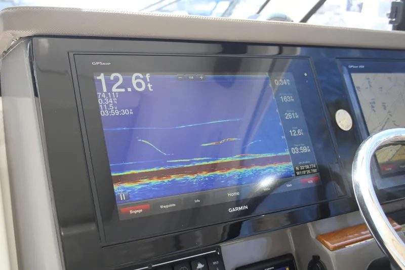 Flawless Seas Yacht Photos Pics Garmin GPS display on 2019 Pursuit DC 365 Dual Console boat dashboard.
