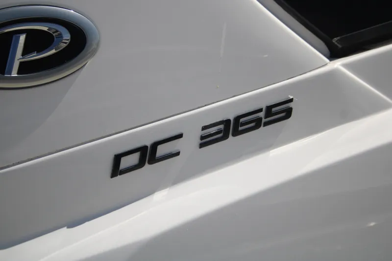 Flawless Seas Yacht Photos Pics 2019 Pursuit DC 365 Dual Console boat emblem and model number.