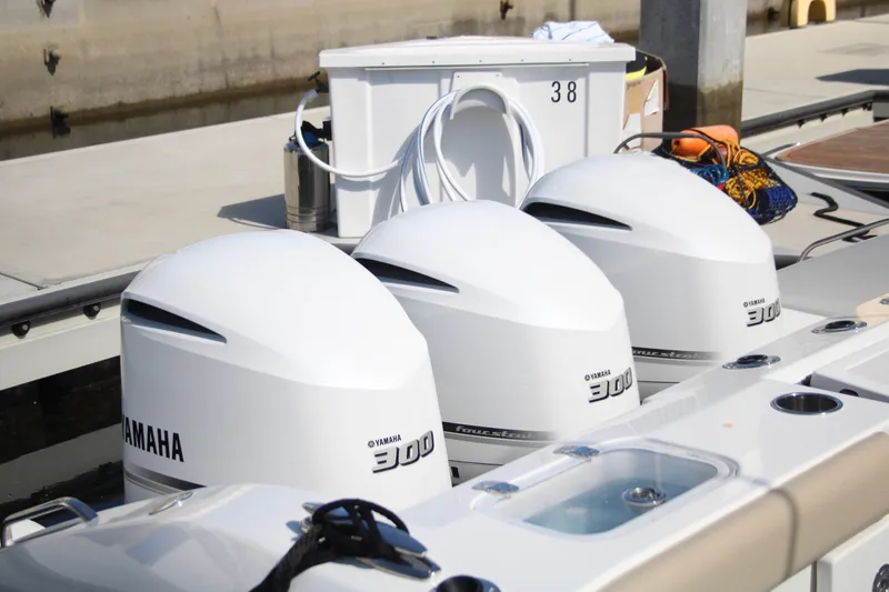Flawless Seas Yacht Photos Pics Triple Yamaha 300 outboard engines on a 2019 Pursuit DC 365 Dual Console boat.
