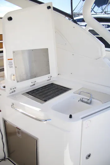 Flawless Seas Yacht Photos Pics 2019 Pursuit DC 365 Dual Console boat with built-in grill and sink.