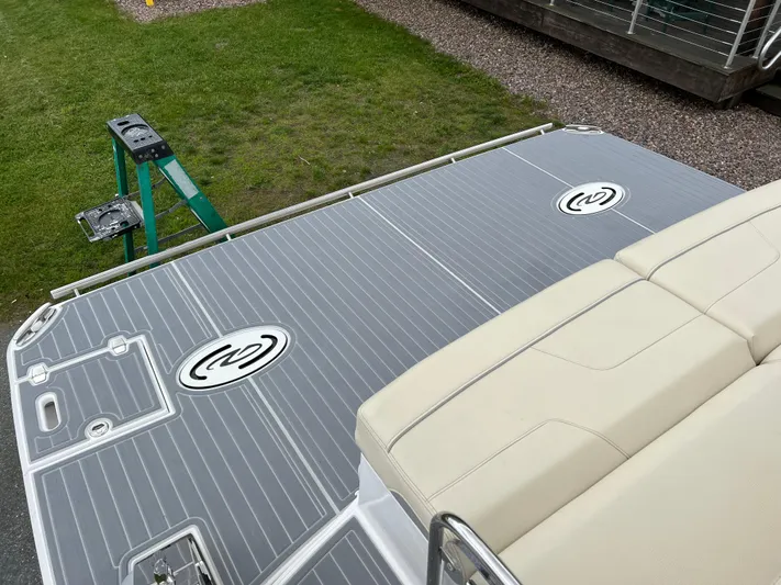  Yacht Photos Pics 2022 Regal LS36 boat deck with beige seating and gray flooring.