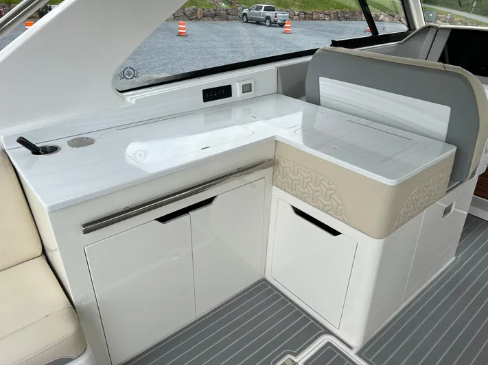  Yacht Photos Pics 2022 Regal LS36 boat interior with sleek white cabinetry and modern design.