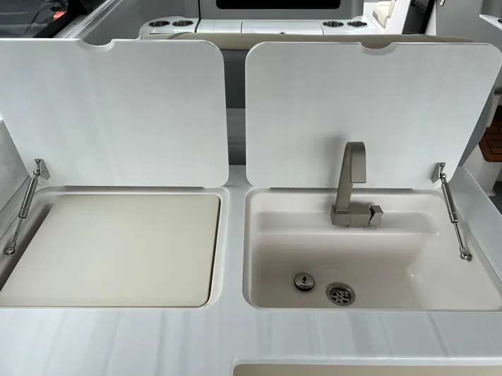  Yacht Photos Pics 2022 Regal LS36 boat kitchen sink and countertop with modern design.