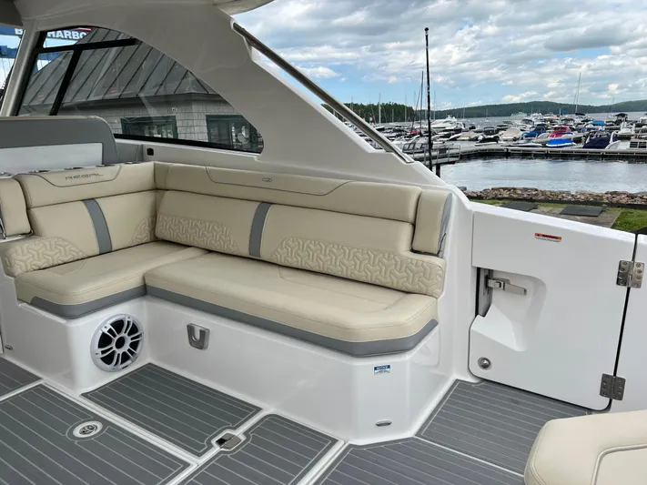 Yacht Photos Pics Luxurious 2022 Regal LS36 boat interior with beige seating at marina.