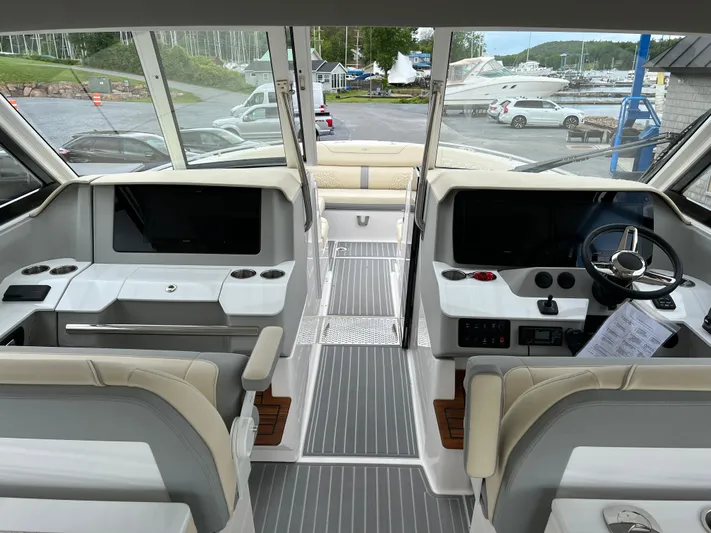  Yacht Photos Pics 2022 Regal LS36 boat interior with modern dashboard and seating.