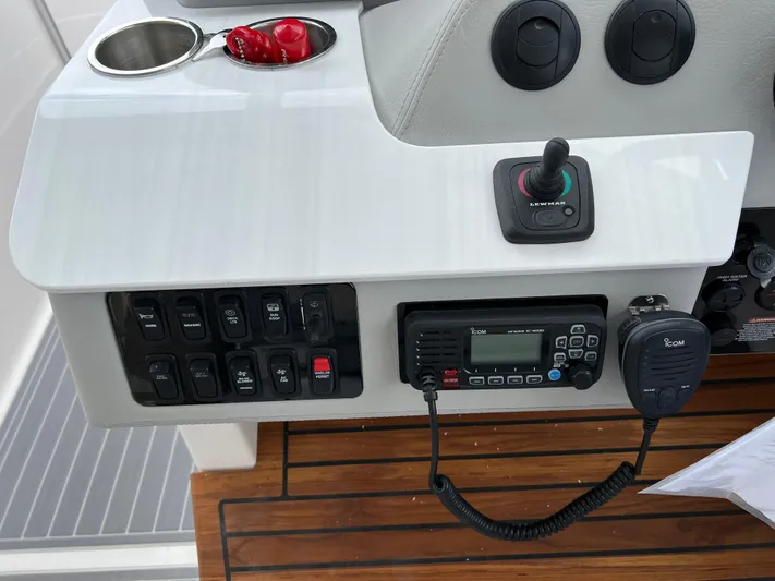  Yacht Photos Pics Control panel of 2022 Regal LS36 boat with radio and switches.