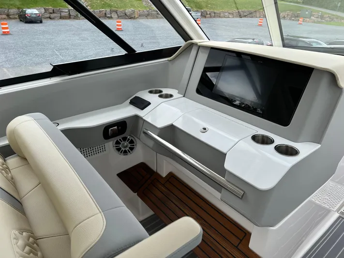  Yacht Photos Pics 2022 Regal LS36 boat interior with modern dashboard and seating.