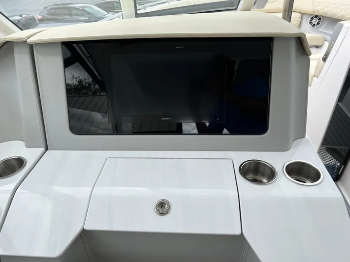  Yacht Photos Pics 2022 Regal LS36 boat dashboard with screen and cup holders.