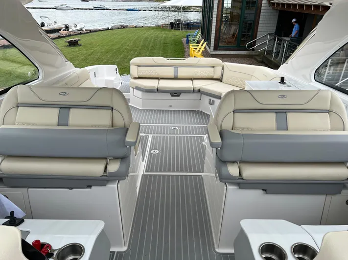  Yacht Photos Pics Luxurious 2022 Regal LS36 boat interior with plush seating and elegant design.