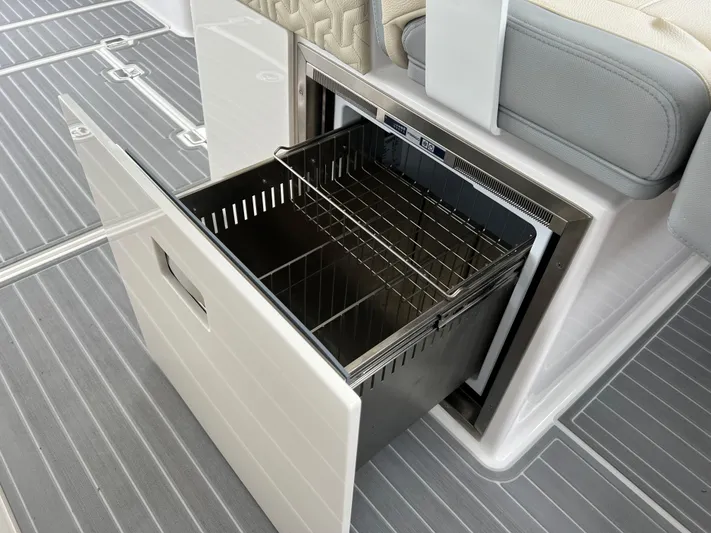  Yacht Photos Pics 2022 Regal LS36 boat with open storage compartment and wire basket.