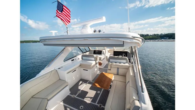  Yacht Photos Pics 2022 Regal LS36 boat interior with American flag on a sunny day.