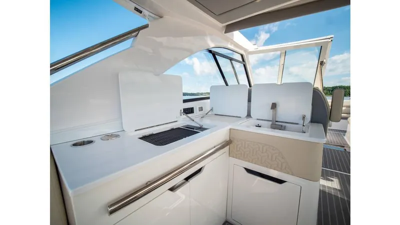  Yacht Photos Pics 2022 Regal LS36 yacht interior with modern kitchen and sleek design.