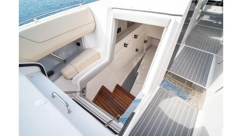  Yacht Photos Pics 2022 Regal LS36 boat interior with stairs and seating area.