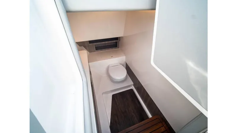  Yacht Photos Pics 2022 Regal LS36 boat interior bathroom with modern design and compact layout.