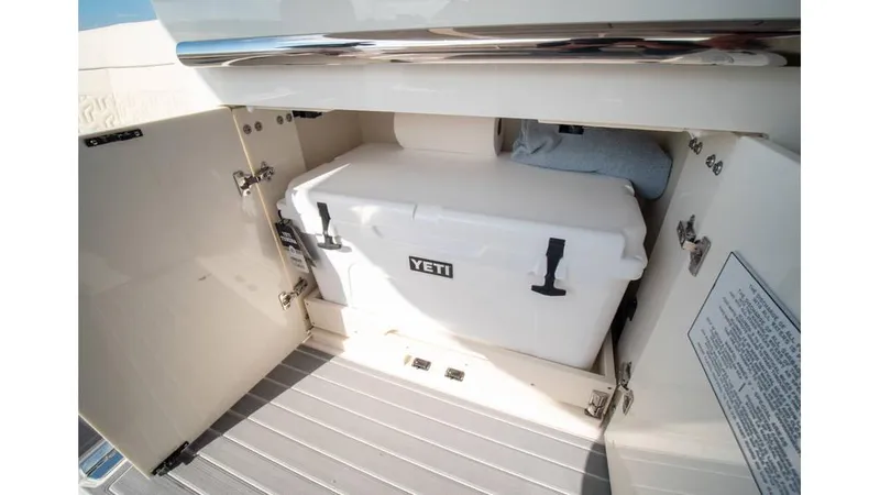  Yacht Photos Pics Regal LS36 2022 boat storage with Yeti cooler in compartment.