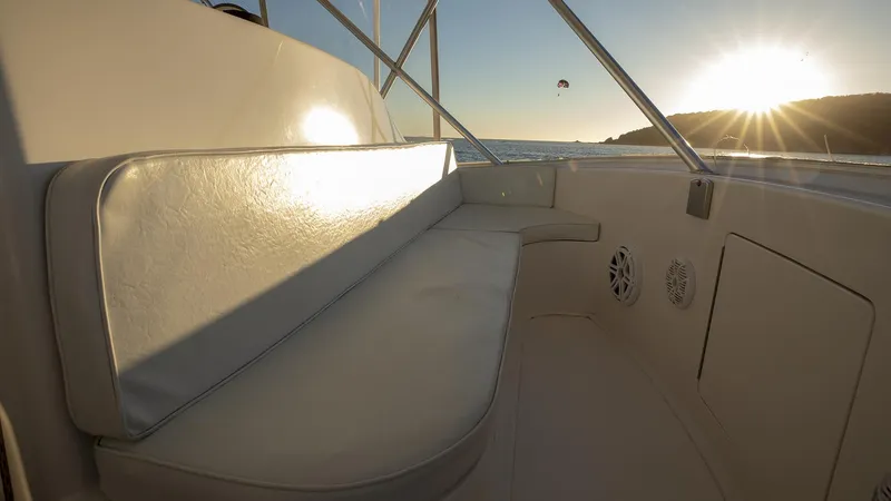 Todo Shine Yacht Photos Pics 2007 Viking 45 Convertible boat interior with sunset view over the ocean.