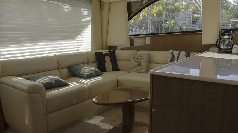 Todo Shine Yacht Photos Pics Luxurious interior of a 2007 Viking 45 Convertible yacht with plush seating and elegant decor.