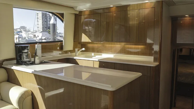 Todo Shine Yacht Photos Pics Luxurious kitchen interior of 2007 Viking 45 Convertible yacht with modern amenities.