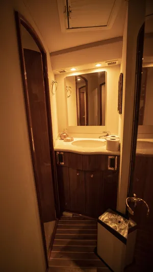 Todo Shine Yacht Photos Pics 2007 Viking 45 Convertible yacht bathroom with wood accents and modern fixtures.