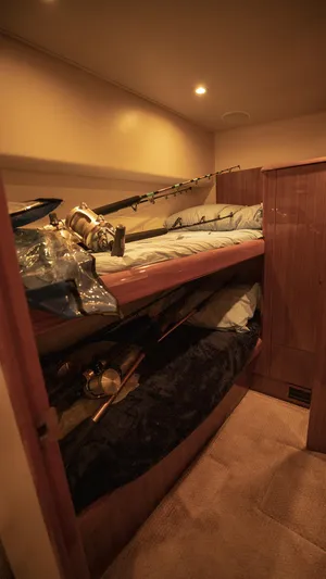 Todo Shine Yacht Photos Pics 2007 Viking 45 Convertible cabin with bunk beds and fishing gear.