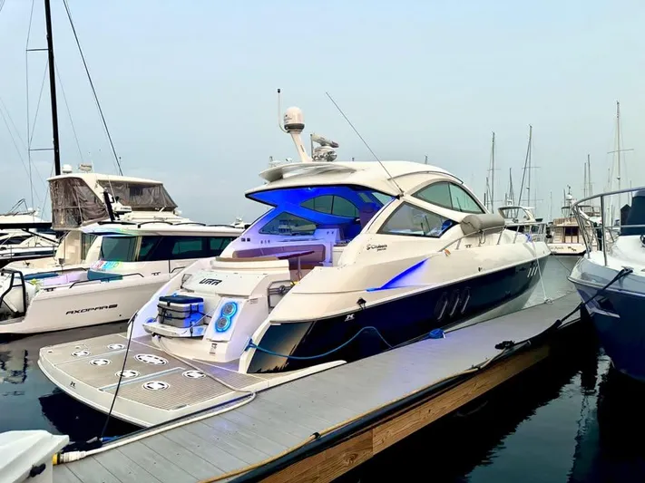  Yacht Photos Pics 2014 Cruisers Yachts 540 SC docked, featuring sleek design and modern amenities.