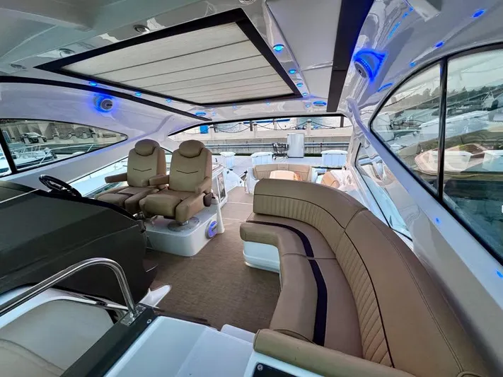  Yacht Photos Pics Luxurious interior of 2014 Cruisers Yachts 540 SC with plush seating and modern design.
