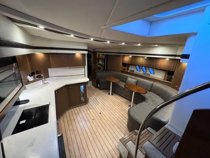  Yacht Photos Pics Luxurious interior of 2014 Cruisers Yachts 540 SC with modern kitchen and seating area.