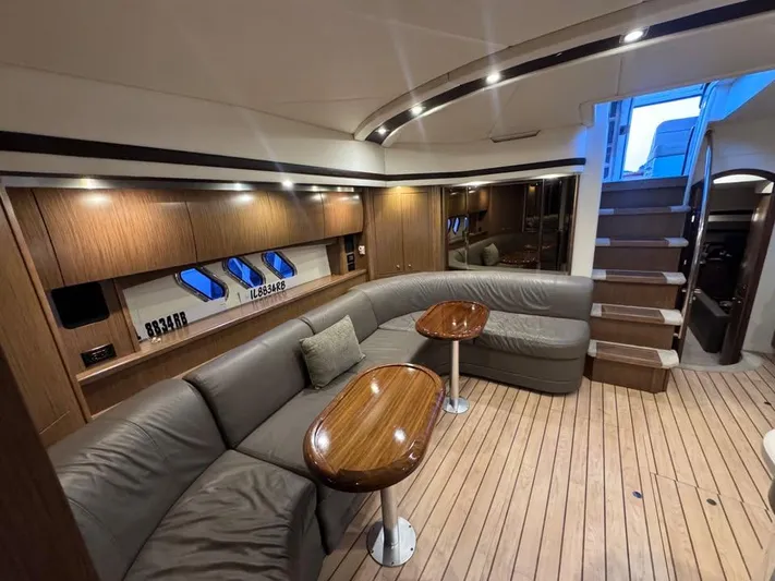  Yacht Photos Pics Luxurious 2014 Cruisers Yachts 540 SC interior with elegant wood finish and plush seating.