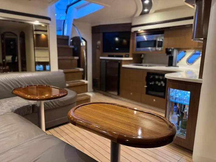  Yacht Photos Pics Luxurious interior of 2014 Cruisers Yachts 540 SC with modern kitchen and seating area.