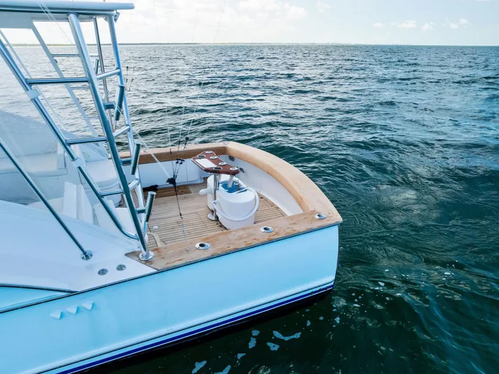 Let's Go Yacht Photos Pics 2018 Custom Carolina 35 Express boat on open water, featuring a sleek deck design.