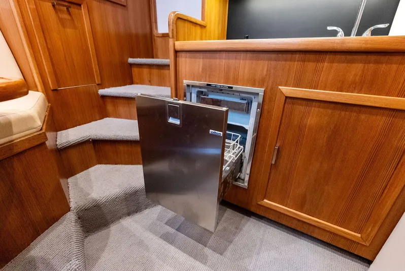 Let's Go Yacht Photos Pics Interior of 2018 Custom Carolina 35 Express with open stainless steel dishwasher.