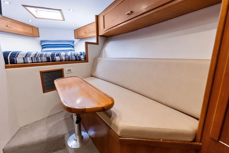 Let's Go Yacht Photos Pics 2018 Custom Carolina 35 Express cabin interior with seating and bed.