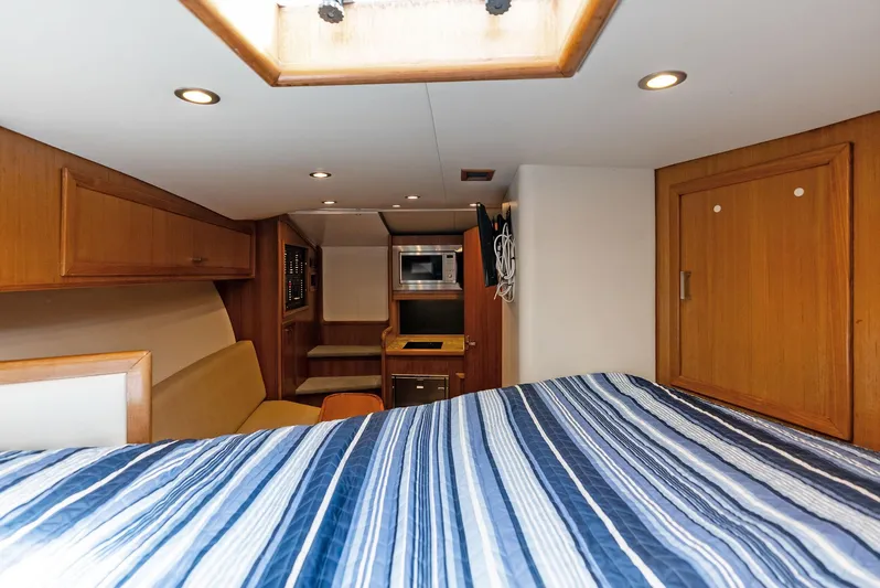 Let's Go Yacht Photos Pics Interior of 2018 Custom Carolina 35 Express boat with cozy cabin and modern amenities.