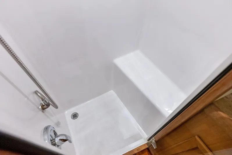 Let's Go Yacht Photos Pics Shower area in 2018 Custom Carolina 35 Express boat, featuring sleek design and fixtures.