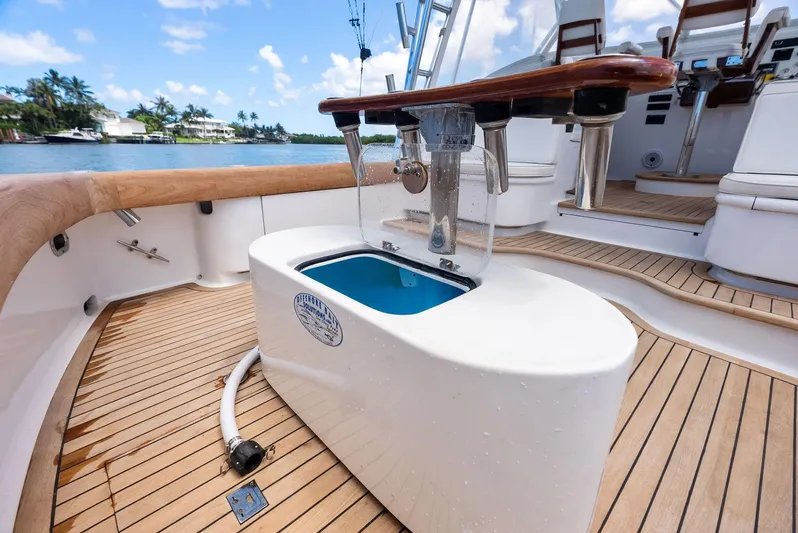 Let's Go Yacht Photos Pics 2018 Custom Carolina 35 Express boat deck with fishing station and scenic waterfront view.