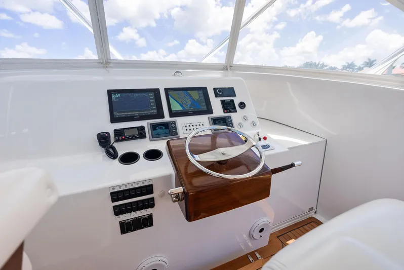 Let's Go Yacht Photos Pics Helm of 2018 Custom Carolina 35 Express boat with modern navigation equipment.