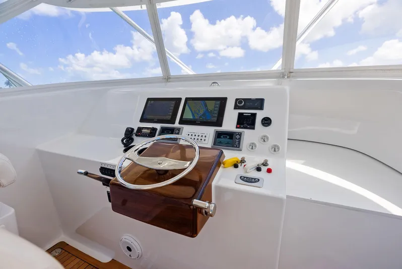 Let's Go Yacht Photos Pics Helm of 2018 Custom Carolina 35 Express boat with navigation screens and controls.