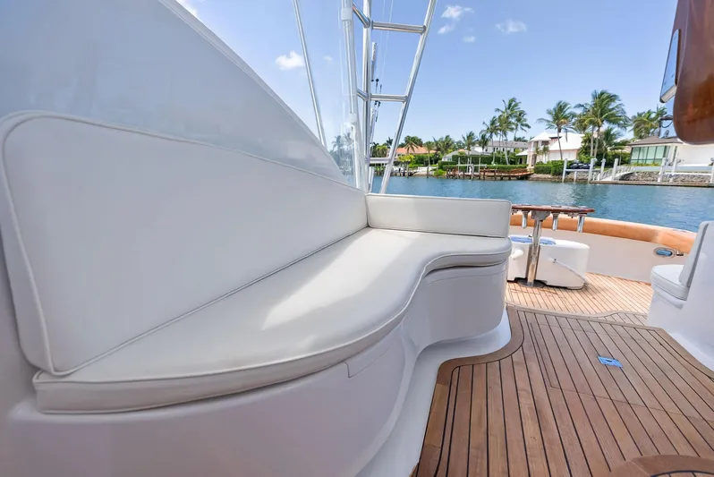 Let's Go Yacht Photos Pics 2018 Custom Carolina 35 Express yacht with white seating and teak deck by waterfront homes.