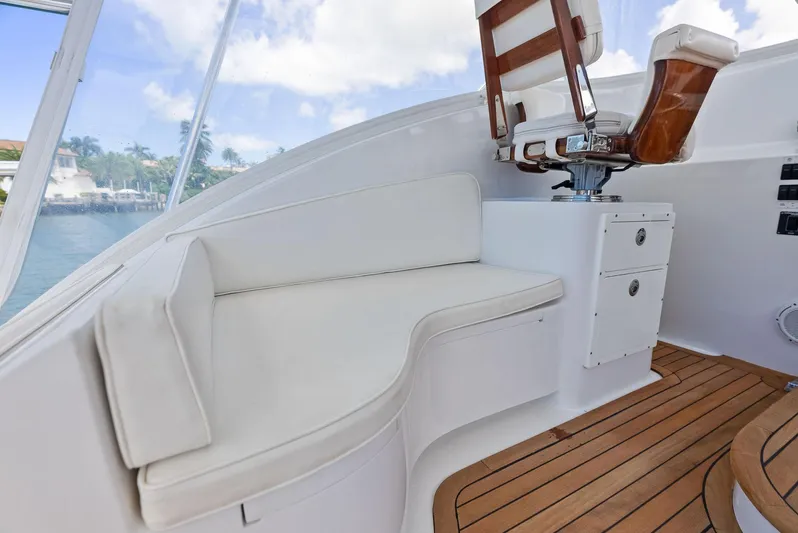 Let's Go Yacht Photos Pics 2018 Custom Carolina 35 Express boat interior with white seating and wooden flooring.