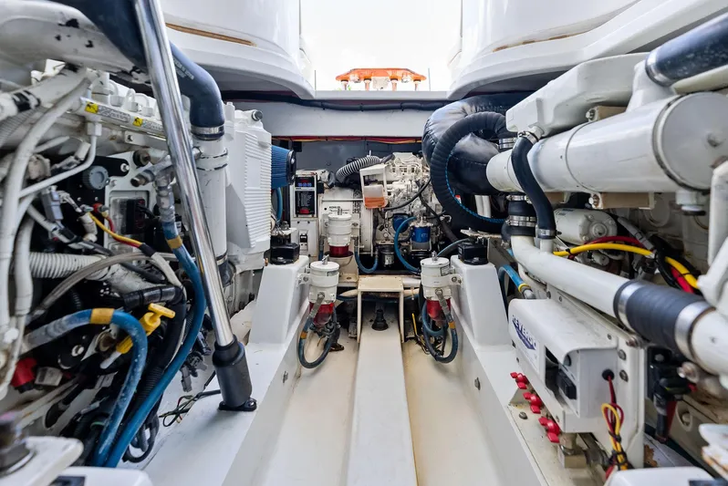 Let's Go Yacht Photos Pics Engine room of 2018 Custom Carolina 35 Express boat, showcasing complex machinery and components.
