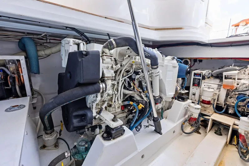 Let's Go Yacht Photos Pics Engine room of 2018 Custom Carolina 35 Express boat, showcasing detailed machinery and components.