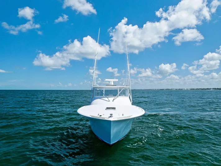 Let's Go Yacht Photos Pics 2018 Custom Carolina 35 Express boat on open sea under blue sky.