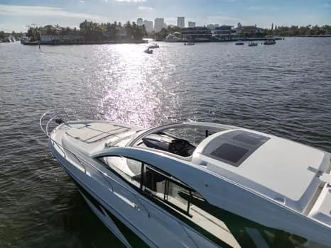 2023 Beneteau Gt45 Yacht Photos Pics 2023 Beneteau Gran Turismo 45 yacht cruising on a sunny waterfront.