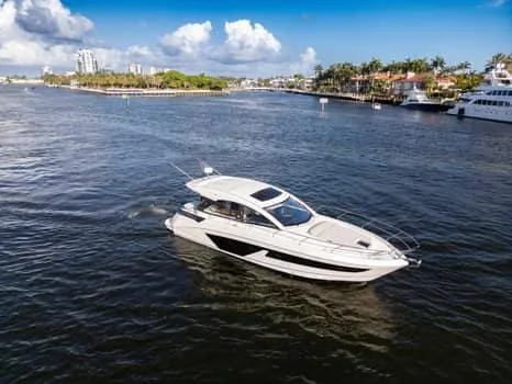 2023 Beneteau Gt45 Yacht Photos Pics 2023 Beneteau Gran Turismo 45 yacht cruising on a scenic waterway.