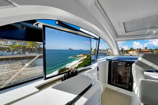 2023 Beneteau Gt45 Yacht Photos Pics Interior of 2023 Beneteau Gran Turismo 45 yacht with ocean view through large windows.